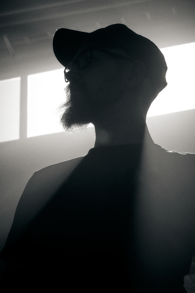 Silhouette portrait of a designer in industrial lighting.